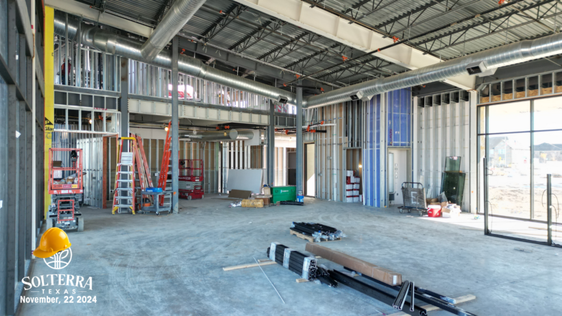 Inside on the bottom floor of The Headquarters Amenity Complex, showing the construction on the inside. Captured November 22nd, 2024.