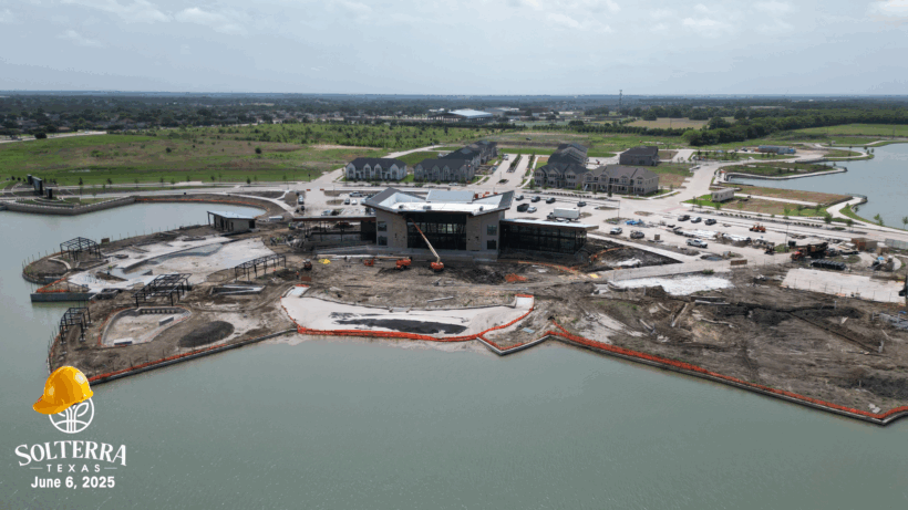Aerial view showing the construction in the back. Captured on June 6, 2025